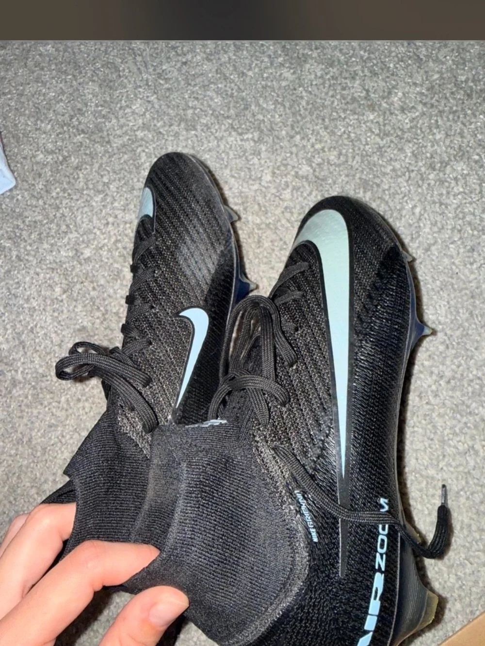 Nike woman’s Gen 4 black and light blue soccer cleats size 6